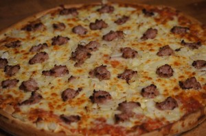 large onion and sausage pizza